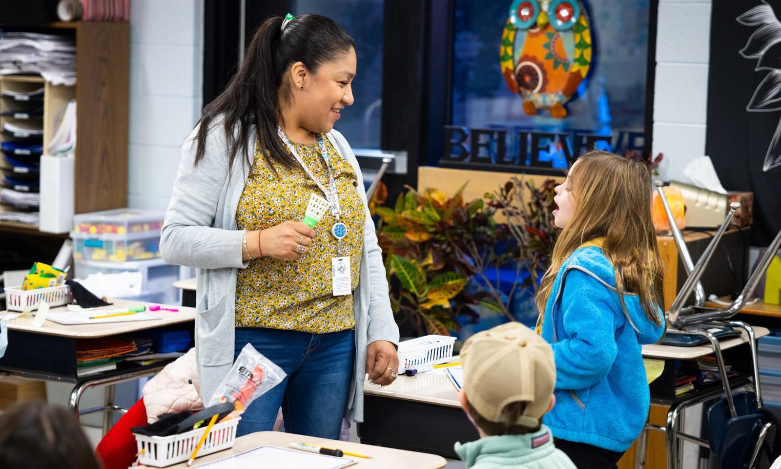 A teacher talks to a student